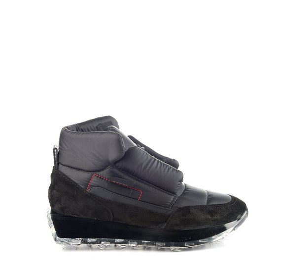 Black padded SNK with black midsole and see-through sole