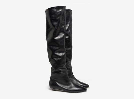 Thigh high boot with metal heel