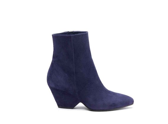 Navy blue suede heeled ankle boots with shell-shaped heel