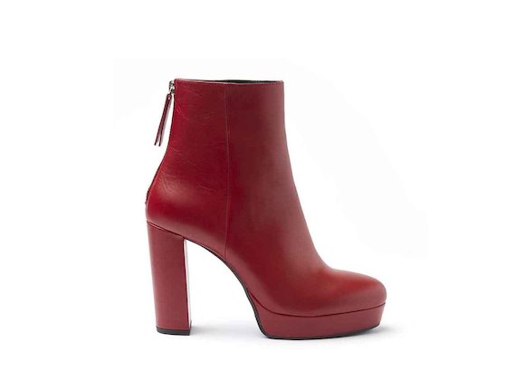Red leather heeled ankle boots with leather-covered platform and heel